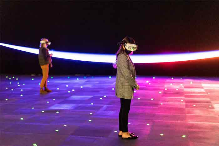 Attendees with VR goggles in the visit to The Infinite Experience in Seattle